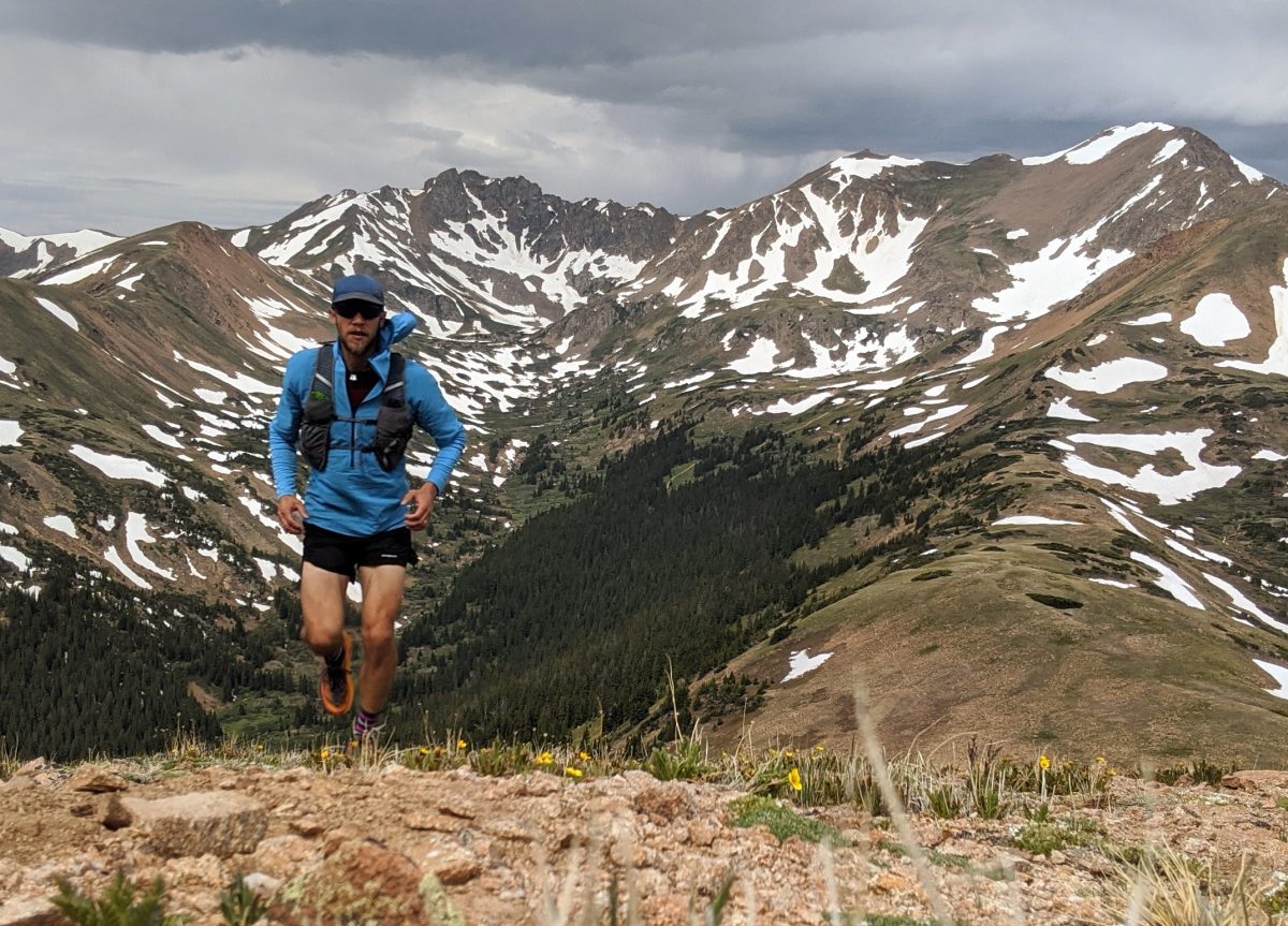 I always carry my Airshed Pro pullover in my vest on mountain runs. It takes up very little space in the vest pocket, but does wonders for staying warm on windy ridges. Unlike most windbreakers with a coated or impregnated fabric, this pullover is super breathable and I can keep wearing it even when running hard.  Patagonia Running Kit 2024 - Drew Thayer of Engearment.com